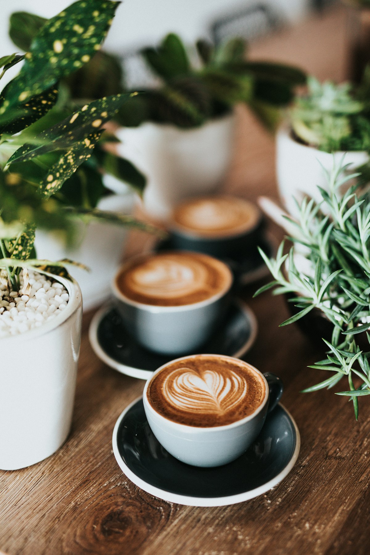 Coffee cup on a table near a window with natural light