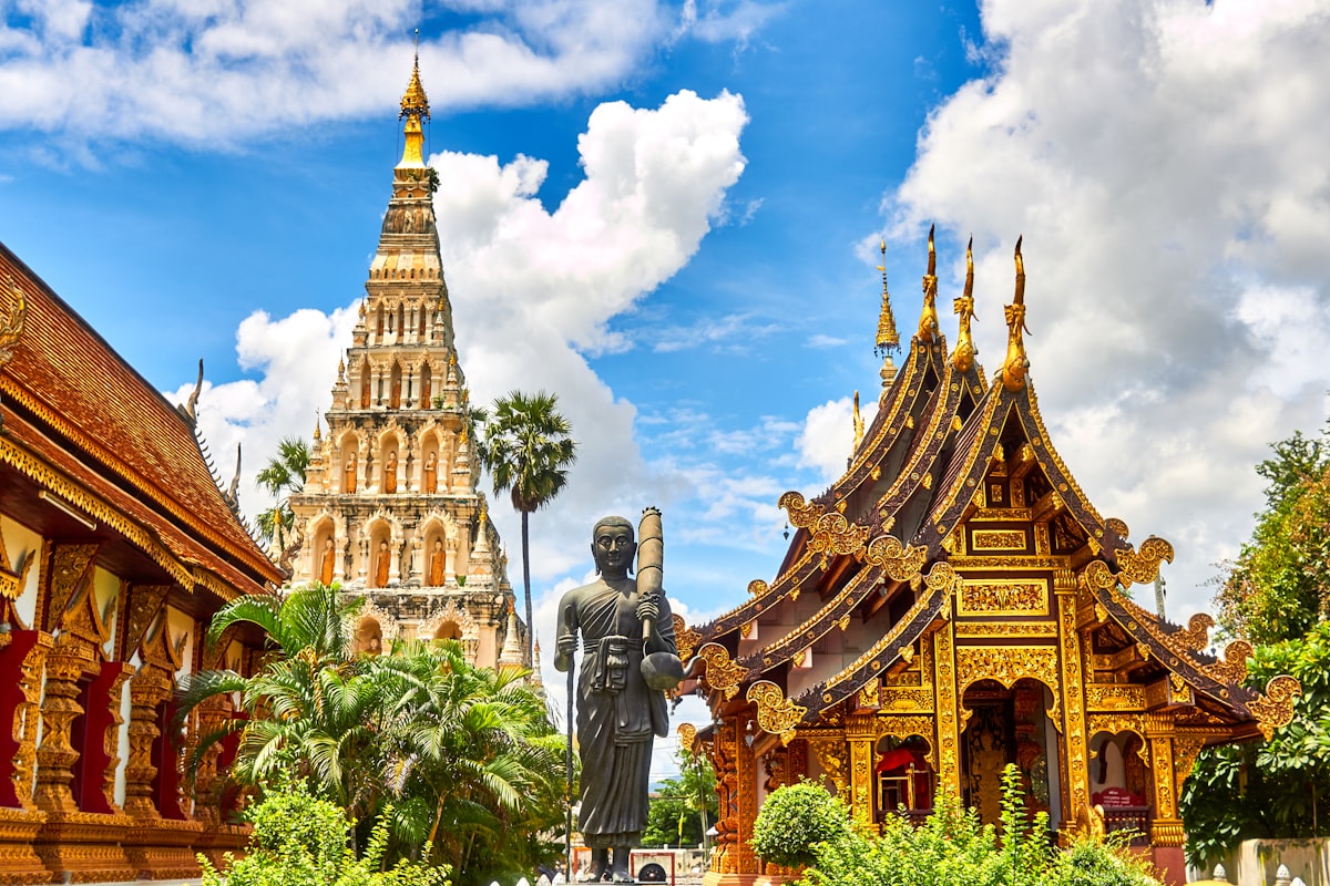 Temple and cultural scenery in a Southeast Asian setting where travellers pass through