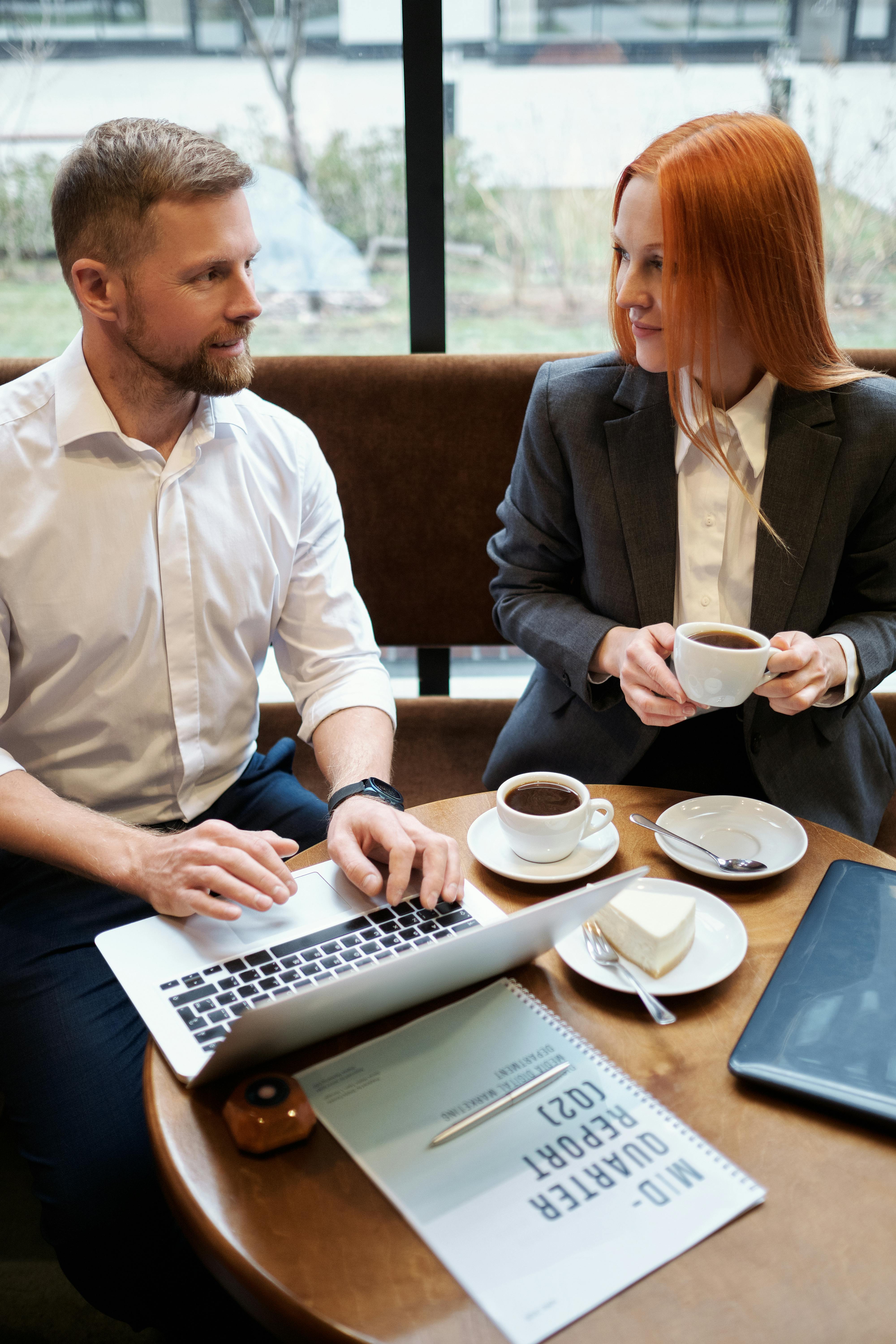 Man and woman having a business meeting in a cafe