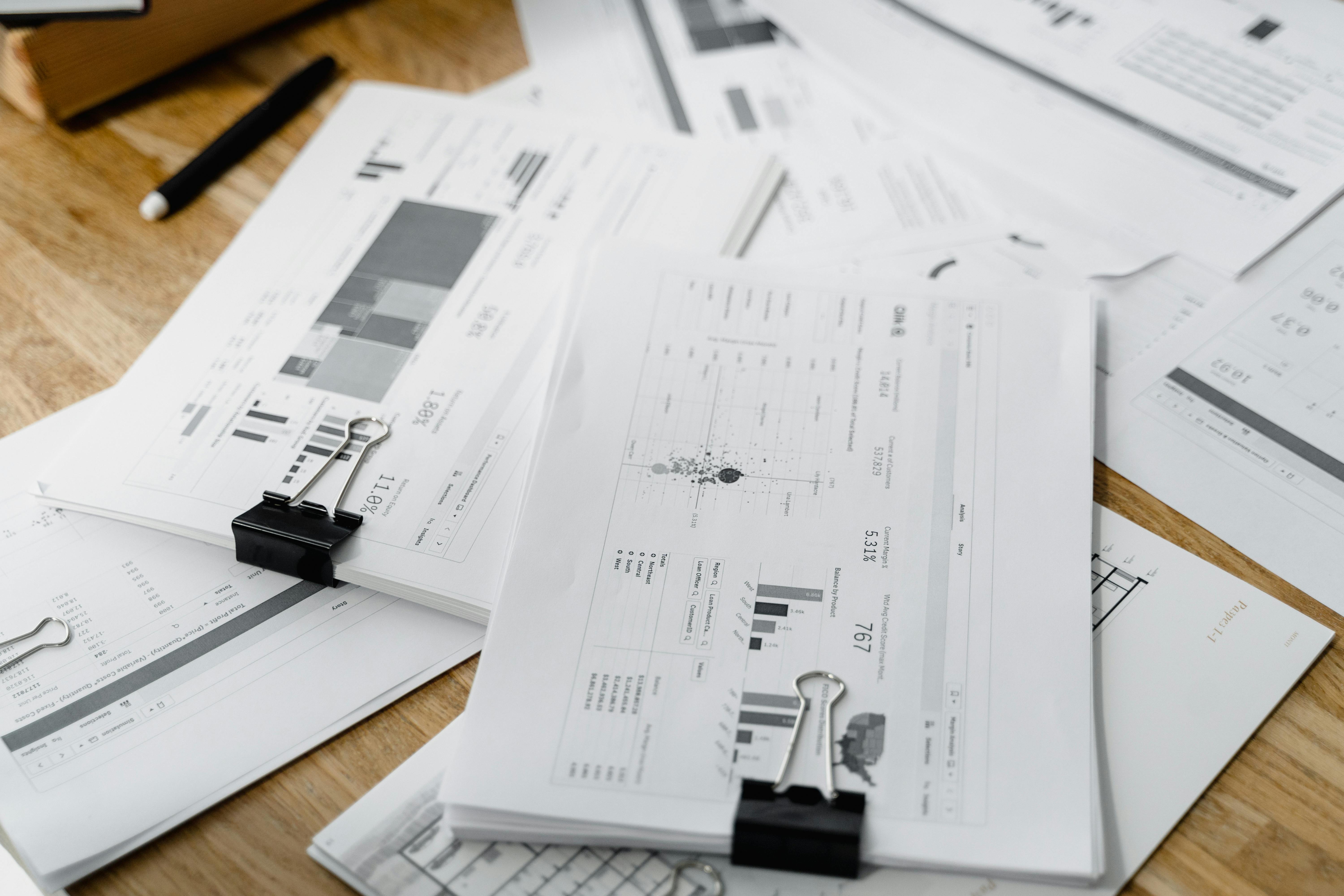 Stack of financial reports on a desk