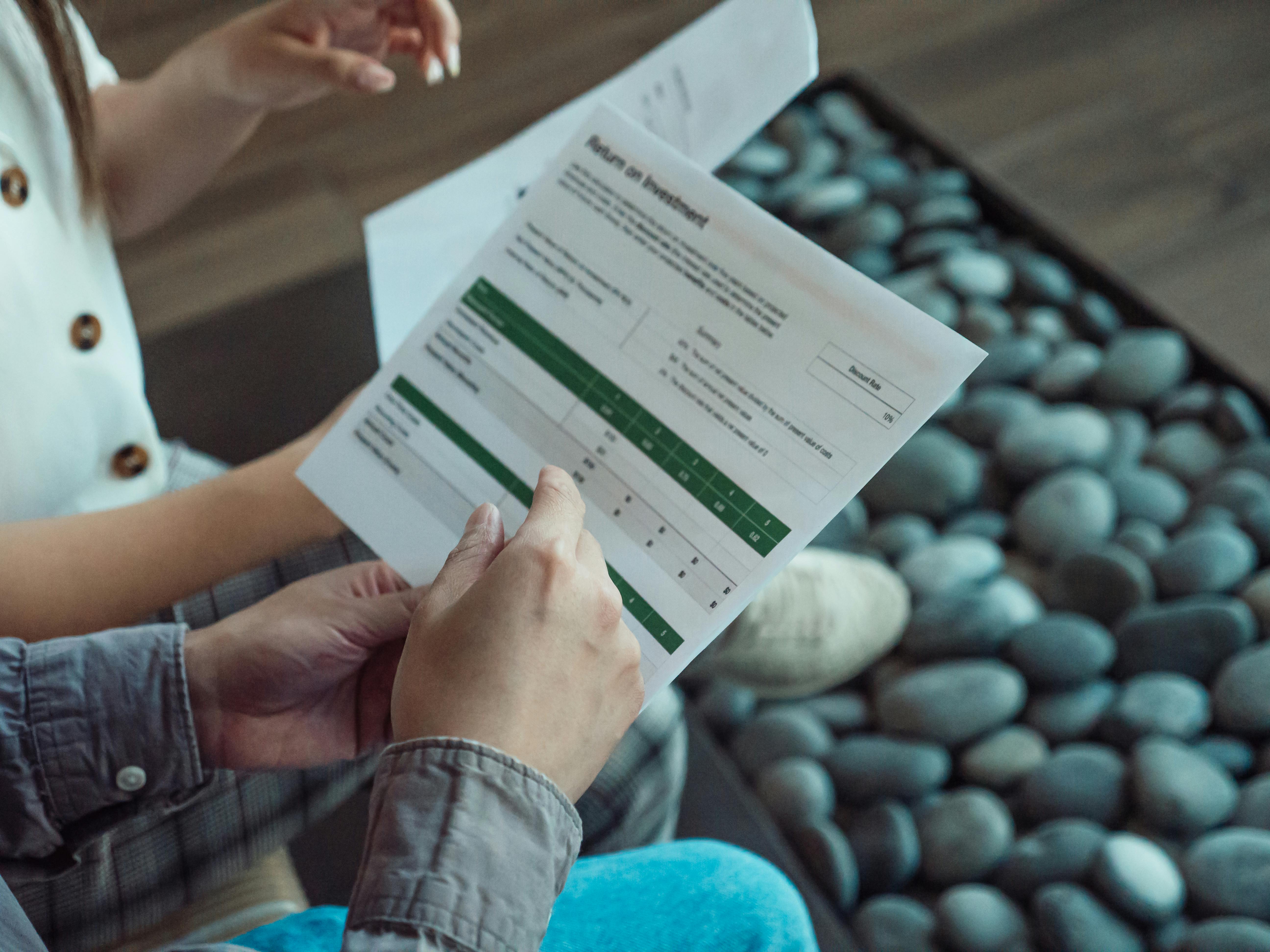 Close-up of a document showing return on investment figures